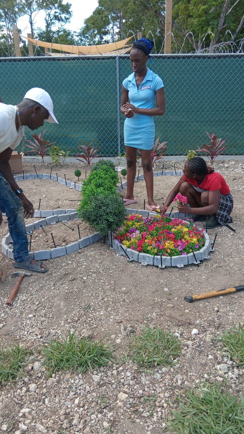 Tending the school flower bed