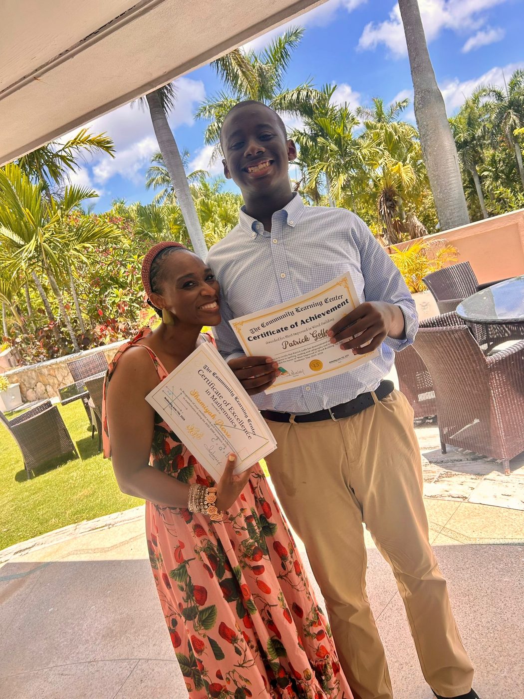 A proud certificate moment with staff